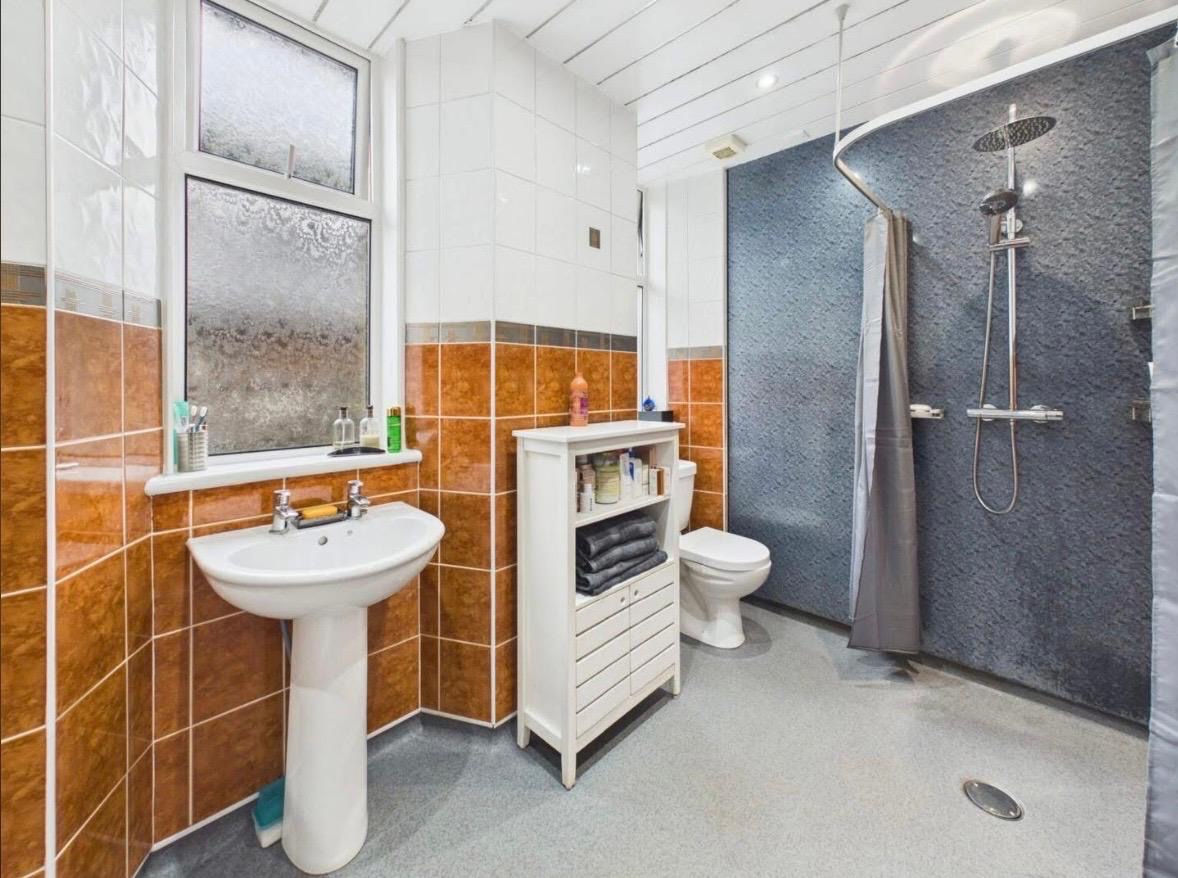 The old wetroom shower area and flooring in the Coatbridge bathroom before work started