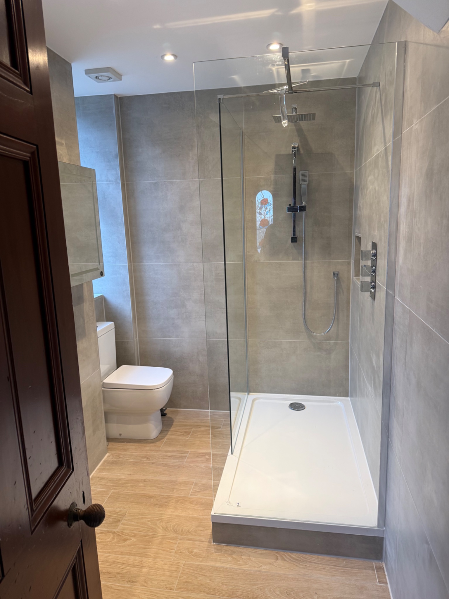 New walk-in shower enclosure and large format tiling in the finished Coatbridge bathroom
