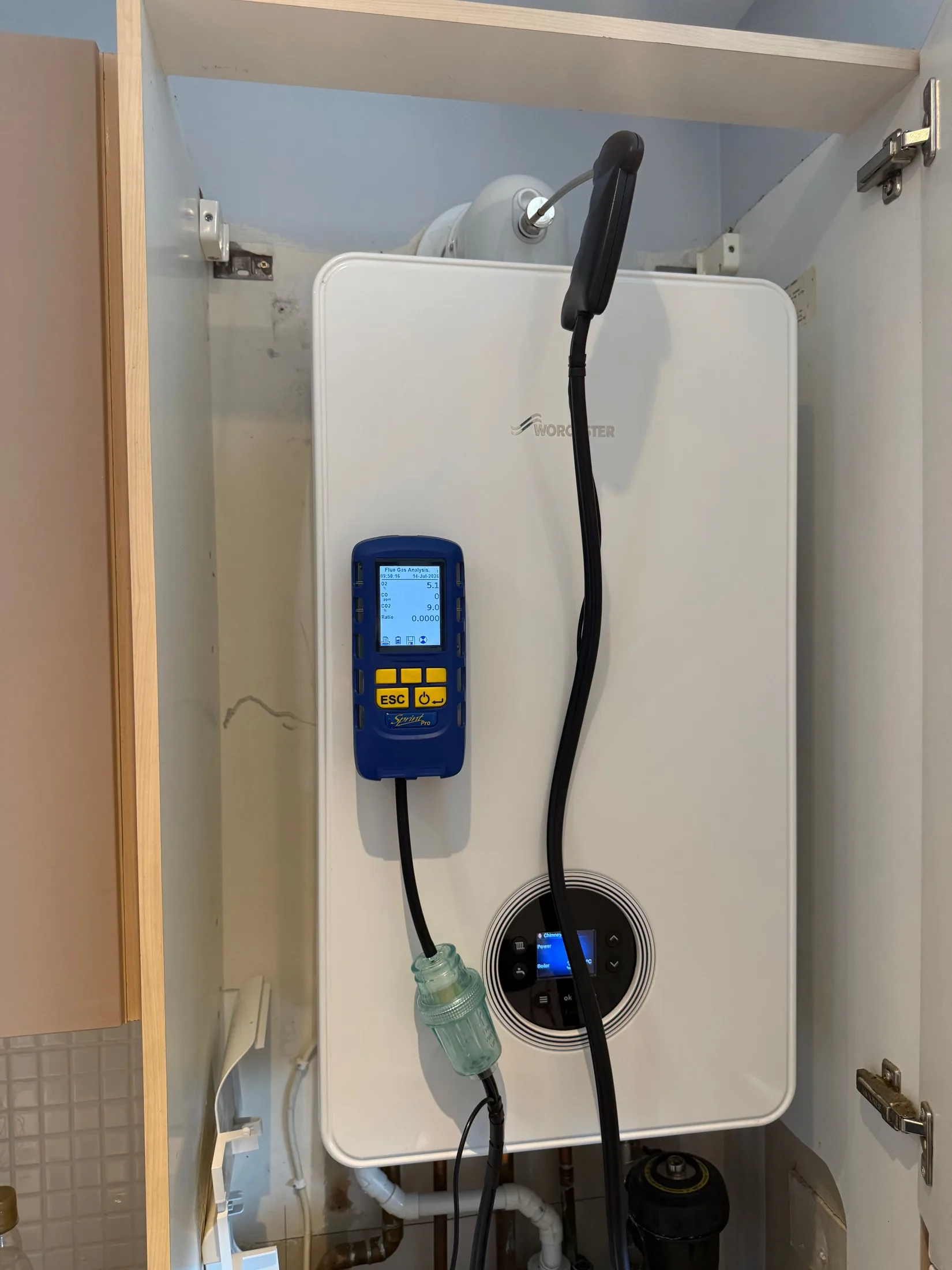 Worcester Bosch boiler on a flue gas analyser during a service in Glasgow