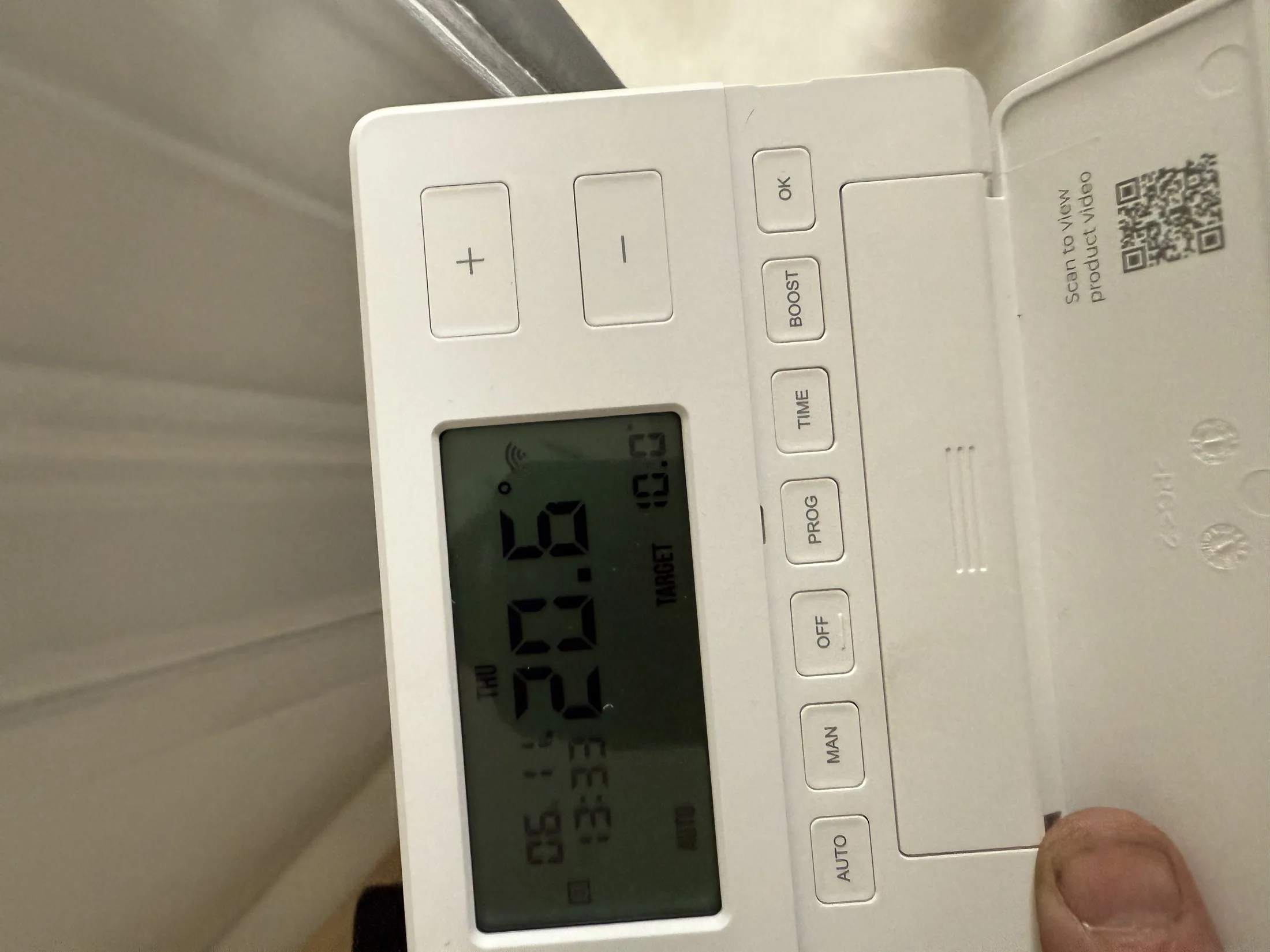 Smart thermostat installation on living room wall