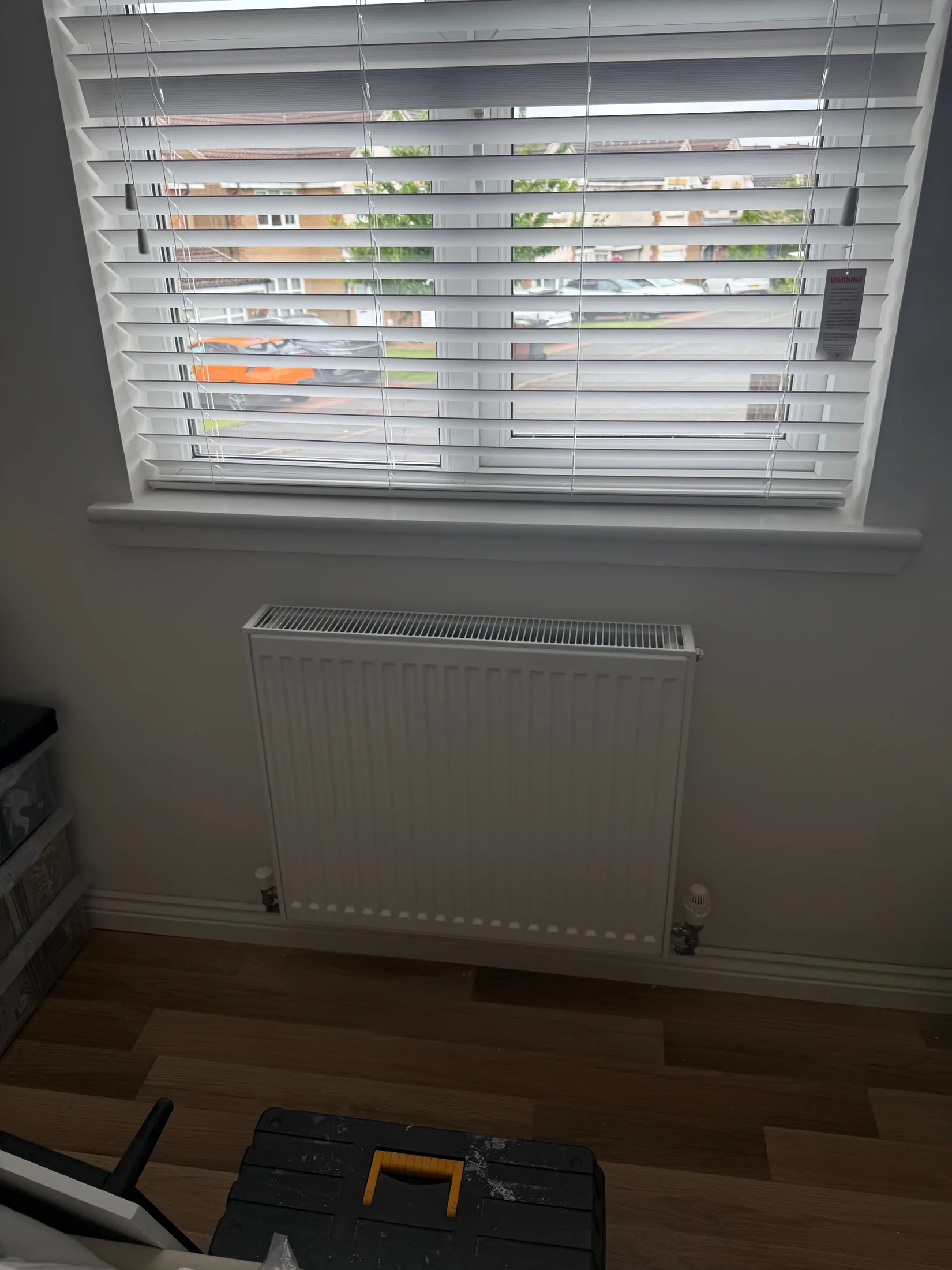White panel radiator installed under a window in Glasgow